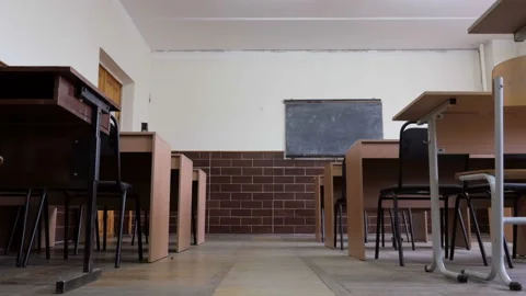 Push in towards chalkboard in empty classroom Stock Footage 95523652