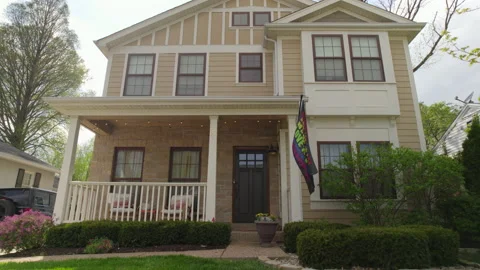 Push towards front door of nice house with rainbow flag Stock Footage 239264754