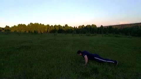 Push ups on the ground-2 Stock Footage 156187114