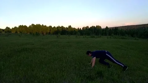 Push ups on the ground-3 Stock Footage 156187116