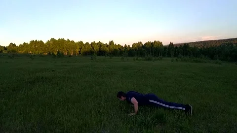 Push ups on the ground Stock Footage 156187112