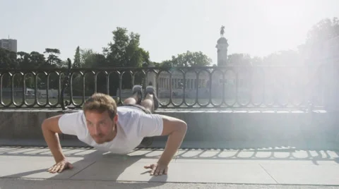 Push-ups man doing push up on run in park - Fitness guy exercising Stock Footage 46417982