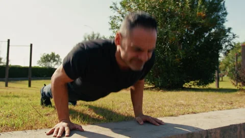 Push ups in the park in spring Stock Footage 331517709