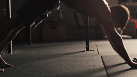 Push ups performed by man in a gym during workout session in the morning Stock Footage 312762142