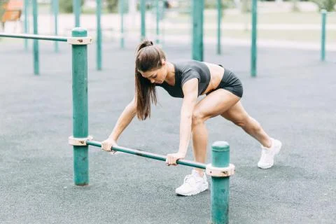Push-UPS, workout and plank on the street. Beautiful athletic girl on the Pla Stock Photos