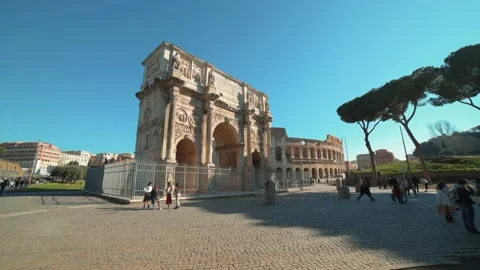 Push in view of Constantine's arch and coliseum in Rome (Arco di Costantino) Stock Footage 134550001