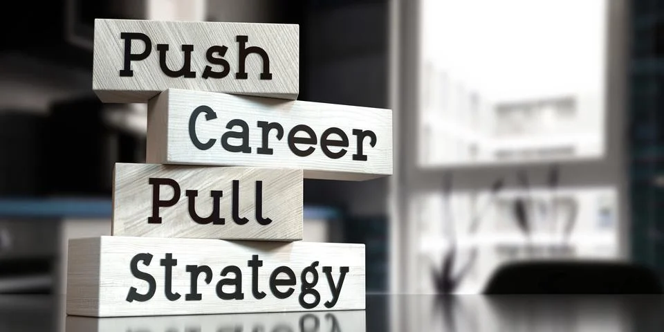 Push vs pull strategy - words on wooden blocks Illustrazione stock
