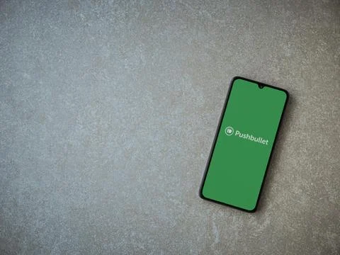 Pushbullet app launch screen on smartphone on ceramic stone background Stock Photos