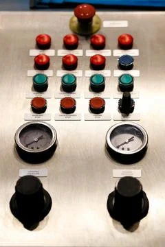 Pushbuttons and gauges on a control panel Stock Photos