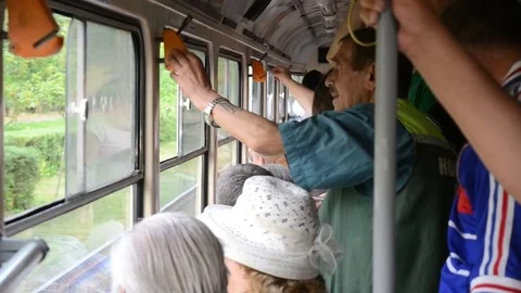 PUSHCHA VODITSA, UKRAINE - CIRCA JUNE 2016 - Tram with many people in the Stock Footage 69777076