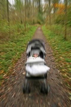 Pushchair fast forest Stock Photos