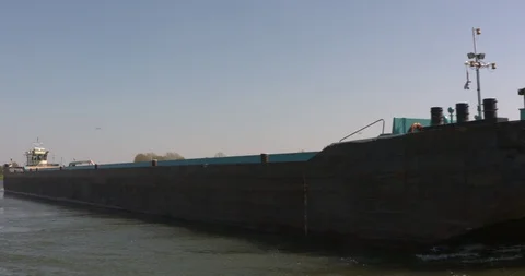 Pusher craft pushing a barge -  on camera Stock Footage 108722270