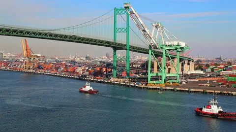 Pusher tug, Cargo Container Ship terminal and Vincent Thomas Bridge in San Pedro Stock Footage 61743580