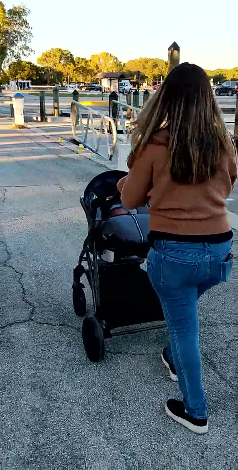 Pushing a baby stroller Stock Footage 219588711