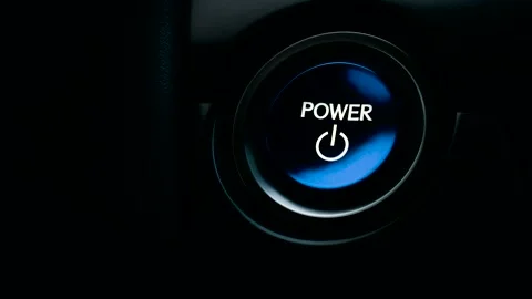 Pushing blue Power ignition Button to start keyless hybrid car engine Stock Footage 145499693