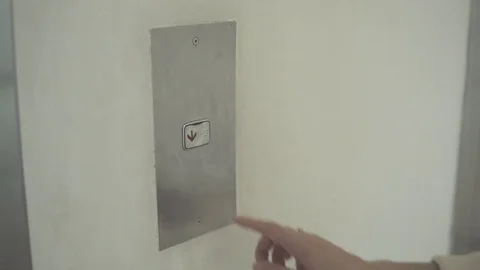 Pushing button. Close-up of female hand pushing button of elevator Stock Footage 79029284