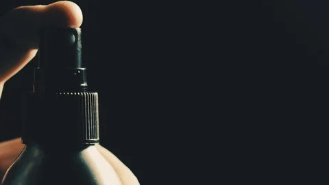Pushing button on the spray bottle, super slow motion. Shot on Red Stock Footage 106588882