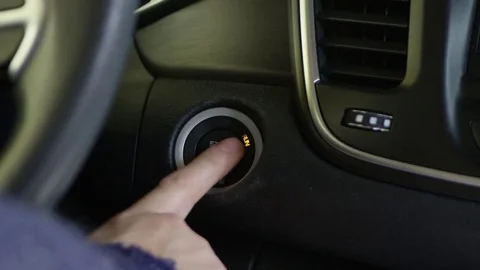 Pushing button to turn car on or off Stock-Footage 69888458