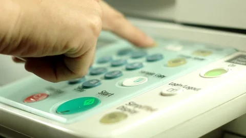 Pushing buttons on copy machine panel, ends with green button. Stock Footage 97280541