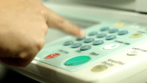 Pushing buttons on copy machine panel, frantically pressing red cancel button. Stock Footage 97280549