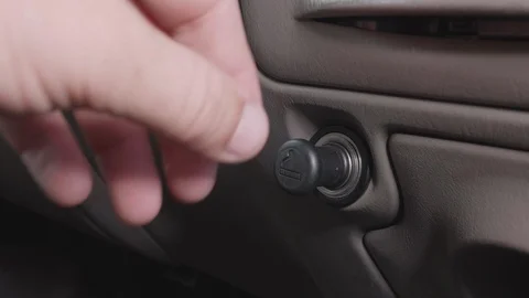 Pushing Cigarette Lighter in Car to Warm it up Stock Footage 120012404