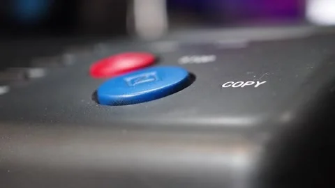 Pushing copy blue button and then push stop red button on stencil copy machine Stock Footage 279305342