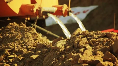 Pushing dirt water into a river Stock Footage 1008861