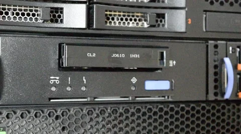 Pushing down tape into the tape drive on Computer Server Stock Footage 55443666
