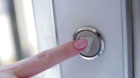 Pushing elevator button for down closeup. Person wants to go down a tall Stock Footage 68061145