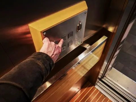 Pushing a elevator button 스톡 사진