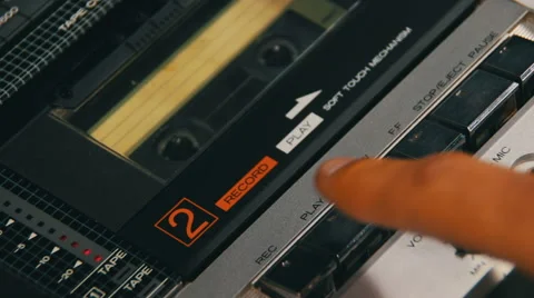 Pushing a Finger Play and Stop Button on a Tape Recorder Stock Footage 61937289