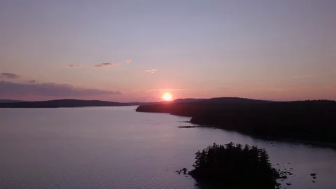 Pushing Forward Sunset Over Lake Stock Footage 129457036