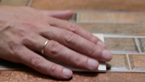 Pushing Light Switch On Ceramic Tile Stock-Footage 114695129