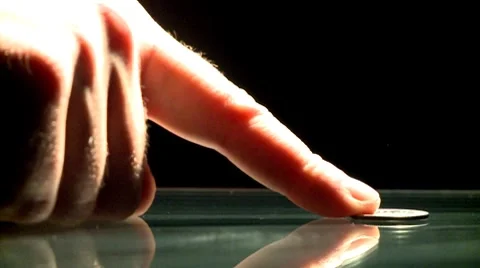 Pushing one coin Stock Footage 8841508