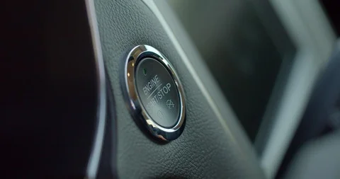 Pushing power ignition button to start keyless ignition hybrid car engine. Stock Footage 128640736