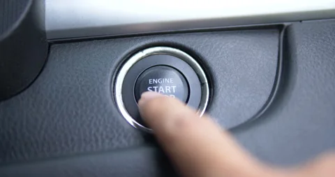 Pushing power ignition button to start keyless ignition hybrid car engine Stock Footage 137768878