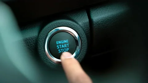 Pushing power ignition button to start keyless ignition hybrid car engine Stock-Footage 140795591