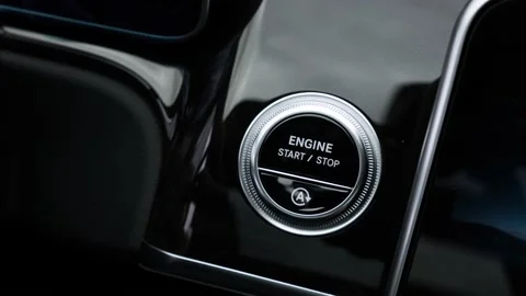 Pushing power ignition button to start keyless ignition hybrid car engine. Stock Footage 152036467