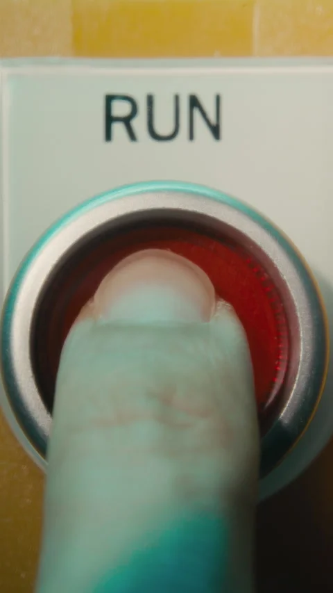 Pushing a red run button to turn on a machine 스톡 동영상 314775388