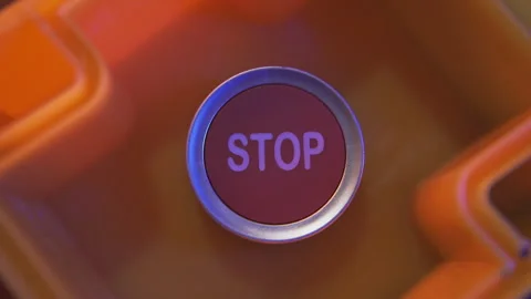 Pushing a red stop button Stock Footage 286098135