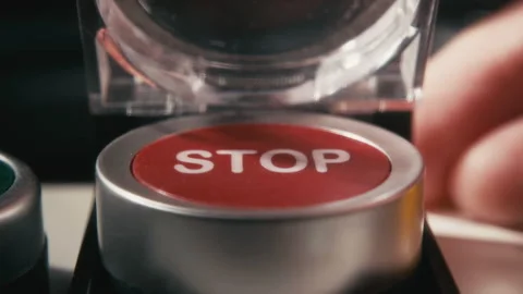 Pushing a Red Stop Button with a Safety Cover Stock Footage 315519943