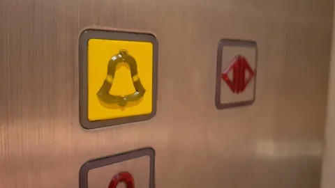 Pushing rescue bell button in elevator Stock Footage 118049382