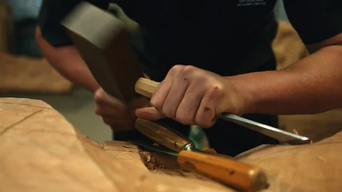 Pushing-in shot of hammer and chisel carving wood Stock Footage 89801730