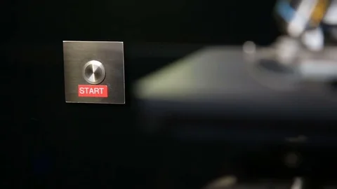 Pushing silver start button Stock Footage 69847386