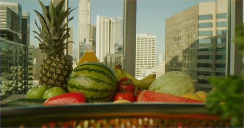 Pushing through composition of fruits and vegetables, sliding over cooking table Stockbeeldmateriaal 126304411