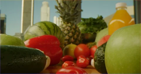 Pushing through composition of fruits and vegetables, sliding over cooking table Video stock 126304481