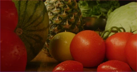 Pushing through composition of fruits and vegetables, sliding over cooking table Vídeo Stock 126304523