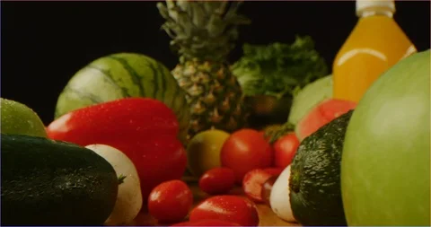 Pushing through composition of fruits and vegetables, sliding over cooking table 库存影片 126304530