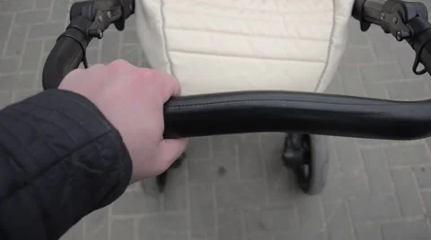 Pushing a trolley with baby. Stock Footage 62485855