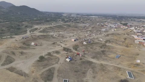 Pushkar Cattle Fair Ground with Camels and Tents Against Aravalli Mountains Stock-Footage 321545027